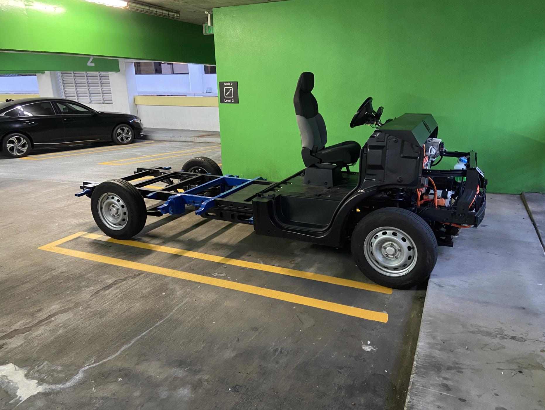 Customer viewing the EV skateboard platform